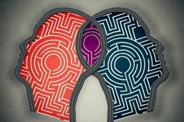 Complicated relationship as concept for group therapy or marriage counseling as two human heads made from maze merging together as icon of partnership solutions isolated gray background